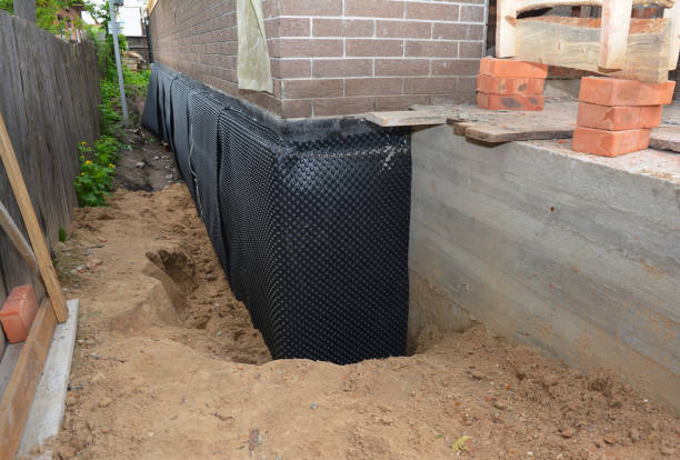 SJ Waterproofing Pros technician performing targeted Waterproofing assessment in Montague, MI